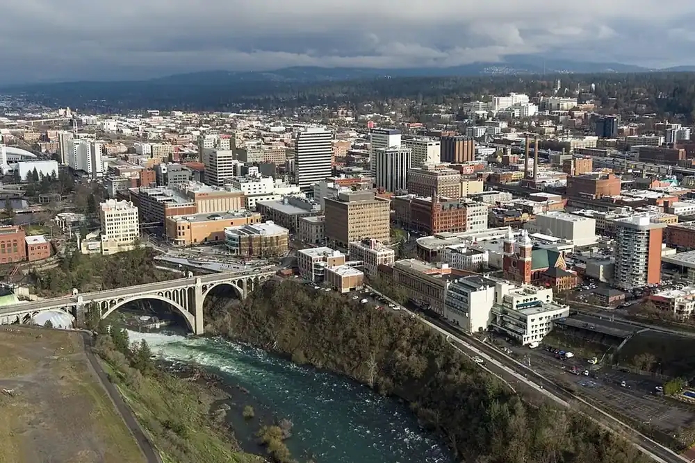 Aerial view of downtown Spokane, Washington, with the Spokane River gorge and an arched bridge
